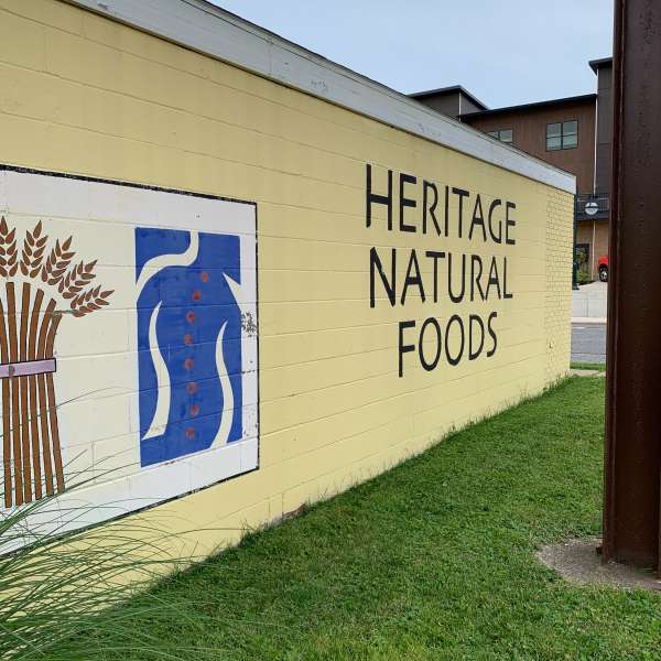painted brick wall reading Heritage Natural Foods